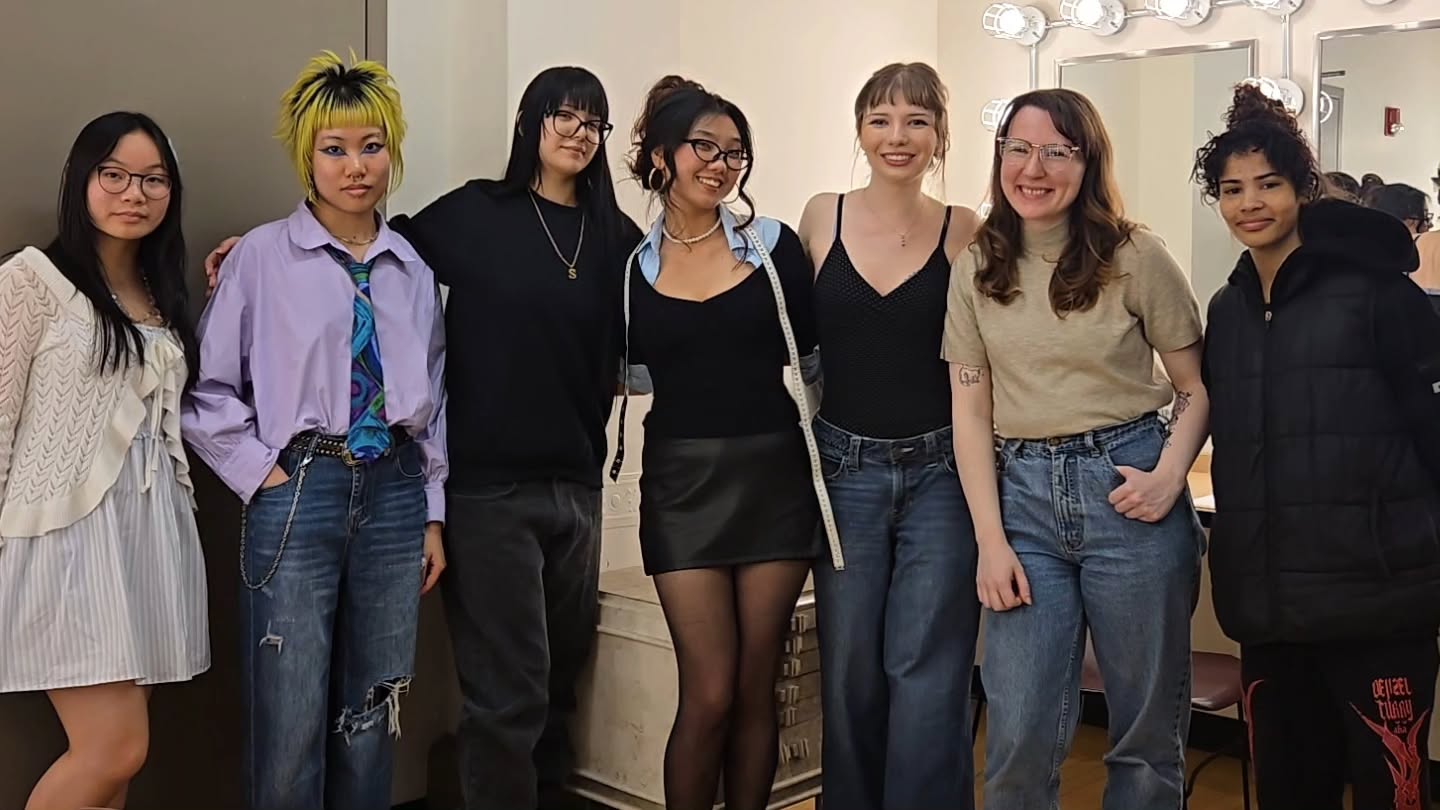 Members of the costume-day group standing together and smiling